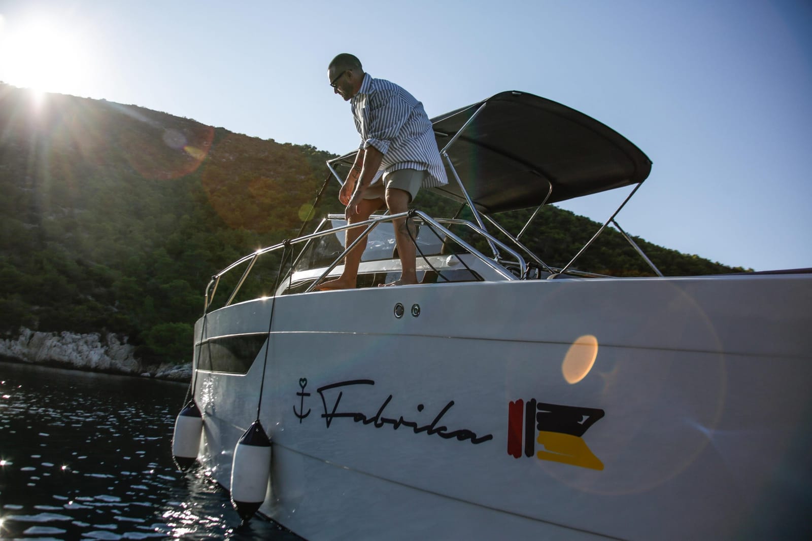 A guest taking in the view from the bow of the Nuva M9 off island Vis